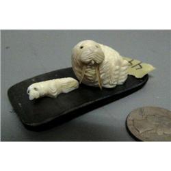 Carved ivory mother and baby walrus on baleen done by Robert Apatiki- baleen is 2-1/2" by 1-1/2"