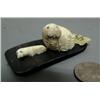 Image 1 : Carved ivory mother and baby walrus on baleen done by Robert Apatiki- baleen is 2-1/2" by 1-1/2"