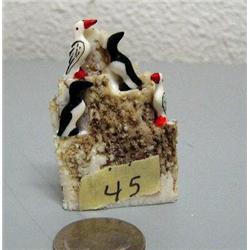 Small rookery with 4 ivory carved birds done by R. B. Kokuluk- 2-1/4" tall