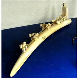 19" white ivory walrus tusk with dog sled team- five dogs and man is 4" tall, ca. 1959 (3)