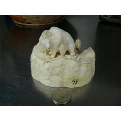 Pair of 2" happy bears carved from whale's tooth, mounted on 4" ivory tusk end, ca. 1960 (3)