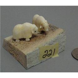 2 carved ivory musk ox mounted on bone