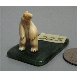Carved ivory standing bear mounted on jade- 1-1/2" tall