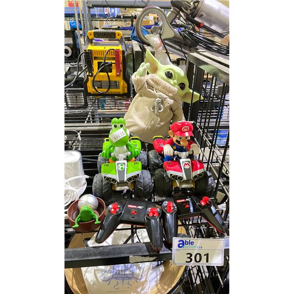 LOT OF ASSORTED TOYS INCLUDING; THE CHILD FIGURE, 2 SUPER MARIO RC CARTS WITH REMOTES & MORE
