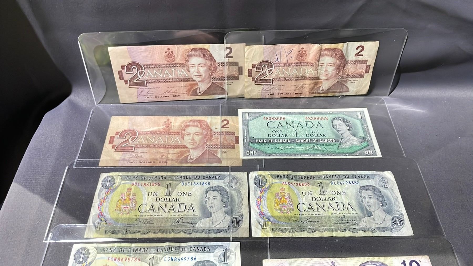 Cadian Notes LOT OF ASSORTED CANADIAN BANK NOTES INCLUDING; $1 (4), $2 (3), $10 (1 ...