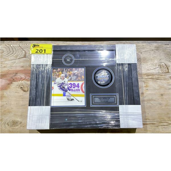 MATTHEW'S SIGNED DRAFT PUCK FRAMED