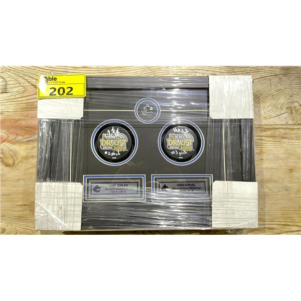 SEDIN DUAL SIGNED PUCKS FRAMED
