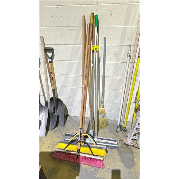 LOT OF ASSORTED BROOMS AND SQUEEGEES