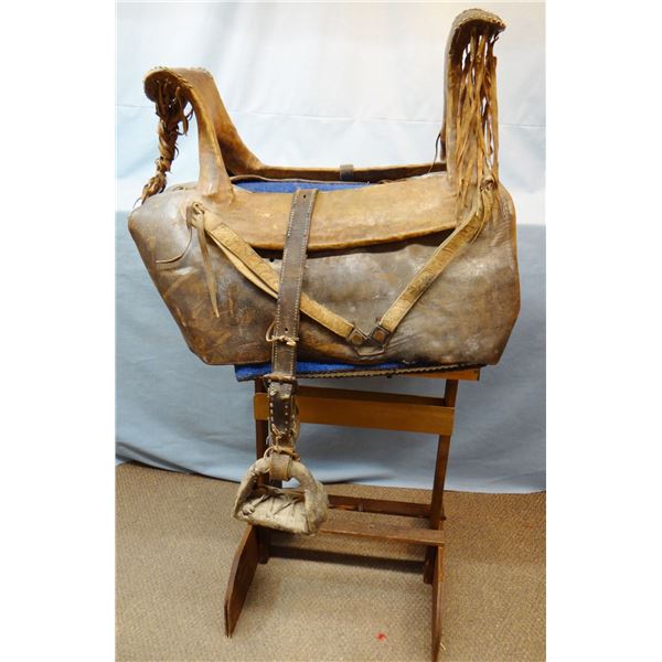 Blackfeet ladies saddle, rawhide over wooden frame, tacked, 24" w, heavy leather skirting, w/provena