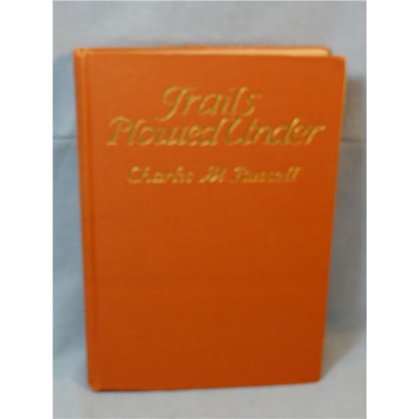 Russell, C.M., Trails Plowed Under, 1928, 1st ed., salmon colored cloth, near fine condition