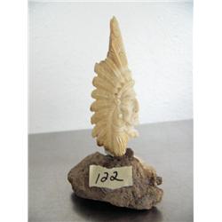 Fossilized ivory Indian Chief face 3" ()