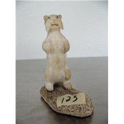 Fossilized ivory 3" standing otter done by Iyak mounted on fossilized ivory base ()