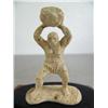 Image 2 : Bone carving of a cave man throwing a rock mounted on wood base ()