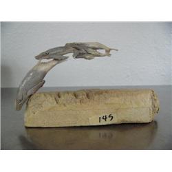 Pod of 4 whales carved out of antler and mounted on bone- imported, not Alaskan ()