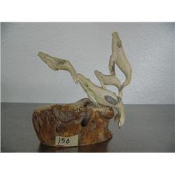 Group of 4 whales carved out of antler mounted on bone- imported, not Alaskan ()