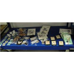 Entire shelf of: 7 pairs of scrimshawed ivory earrings; 12 jade earrings; 5 billiken ivory charms; 3