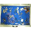 Image 1 : Case of brand new items- totems, bracelets, trade beads, knives, rings, key chains ()