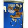 Image 5 : Case of brand new items- totems, bracelets, trade beads, knives, rings, key chains ()