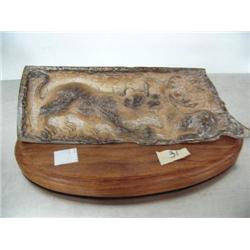 8" mammoth bone carving of saber tooth tiger killing a moose mounted on wood base- relief carved- im