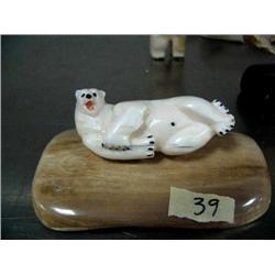 2-3/4" polar bear laying on side mounted on mammoth ivory base by Evak ()