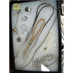 Framed assortment of silver and costume jewelry (74)