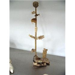20" tall totem with fish, walrus, rams, eagles, buffalo, sea otters carved out of bone- imported, no
