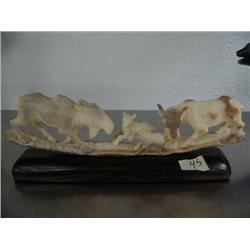 10" fossilized ivory carving of 2 big moose and 2 baby moose mounted on wood base- imported, not Ala