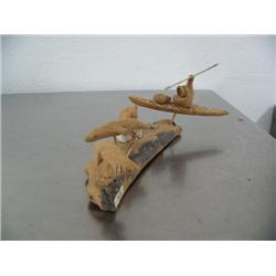 12" cottonwood bark kayaker with 3 seals done by James Sugar in 2003 ()