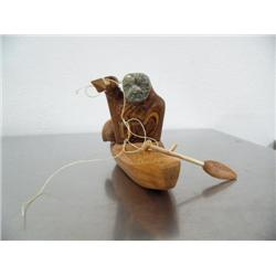 10" cottonwood bark kayaker with soapstone face by Nick Nonkutk ()