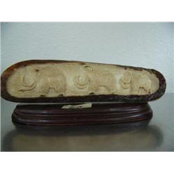 Relief carving of 3 mastodons done on mastodon bark signed GVG- 7" long and 2" high- Russian ()