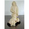 Image 1 : Mammoth ivory carving of Alaskan Native with sled dog on wood base- 5" high- Russian ()