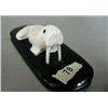 Image 1 : Ivory walrus on baleen base- 4-1/2" long and 1" high ()