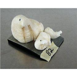 3 ivory walruses with walrus whiskers for tusks on baleen base signed by Robert Apatiki ()