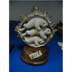 CHOICE on 4 elk antler butt carvings: 3 swimming otters ()