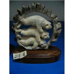CHOICE on 4 elk antler butt carvings: 3 swimming otters ()