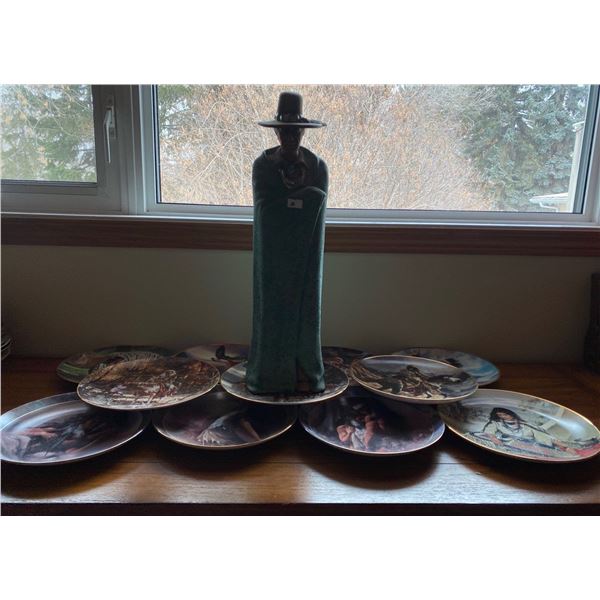 Native Man Stautue And Collection Of Indigenous Style Decorative Plates