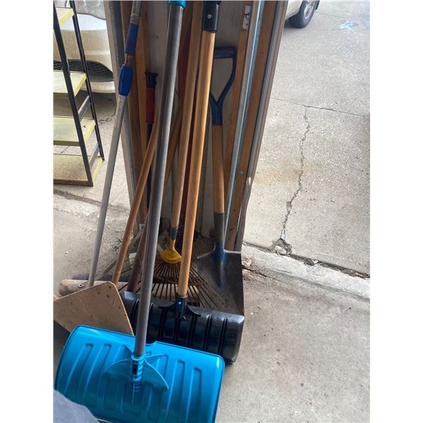 Assortment Of Shovels , Rakes, And Brooms