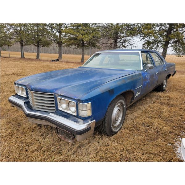 1976 Pontiac Laurentian 4 door sedan. V8 auto, V.G tires, Running, showing 93741 mi, SN. 7K69V613003