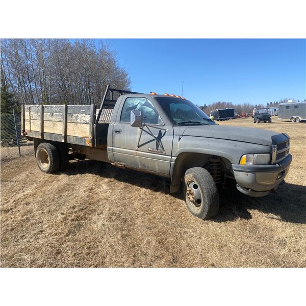 1999 Dodge diesel dually, 4x4,  5 spd standard, c/w 12 volt hoist. 420,545 km. 9'8 foot deck. LT235/