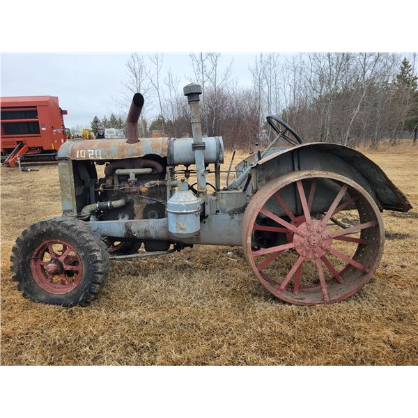 (Lots 50B & 50C are a Group Lot) McCormick 10-20 tractor on steel, not seized on steel, SN. KC5957. 