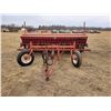 Image 1 : IH 100 press drill 12 Ft, C/W grass & fertilizer rubber packers, hyd. Ram & 2 newer front tires