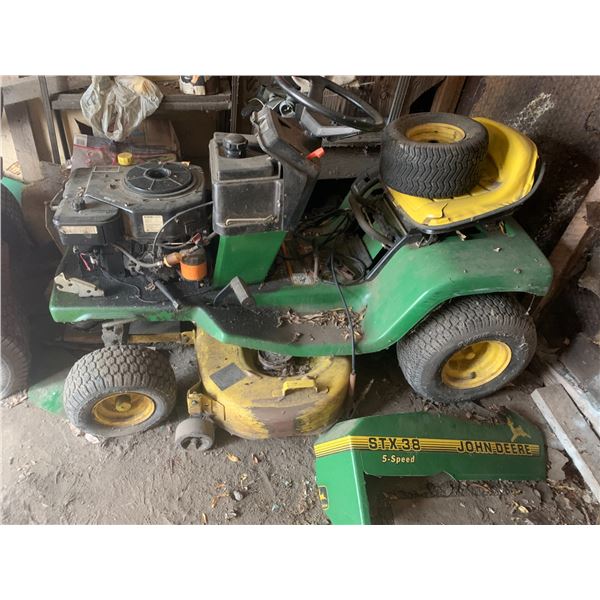 (Selling Off-site location in Waskatenau, PH (780) 576-2287) JD STX38 riding mower, as is