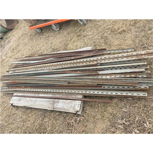 2 pallets of shelving & arms, Located in N.Side field