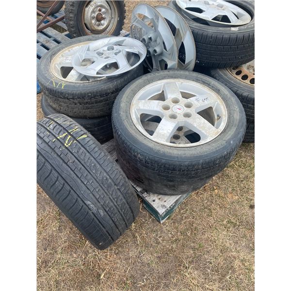 Approx 9 tires , rims & caps, Located in N.Side field