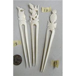 Lot of 3 orderb forks- 6-1/2" long carved out of bone: one has fish, one has gecko, one has pineappl