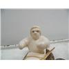 Image 2 : 6-1/2" white ivory kayaker on fossilized ivory base by Iglaak (114)