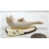 Image 1 : 2-3/4" carved mammoth ivory seal mounted on fossilized walrus ivory by Iglaak of Koyuk (114)