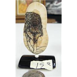 CHOICE on two 3" scrimshawed ivory mounted on baleen by Homer Cole: wolf (114)