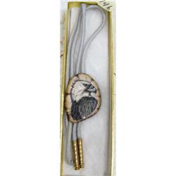 CHOICE on 2 scrimshawed ivory bolo ties by Homer Cole: fossilized ivory eagle's head (114)