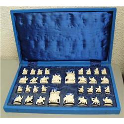Outstanding ivory chess set depicting elephants, camels, horses, and men- king is 3-3/4" tall, pawns